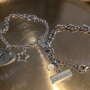 2 Silver Charm Bracelets.
